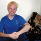 The much-laid Perssen sits on his bed at the hostel.